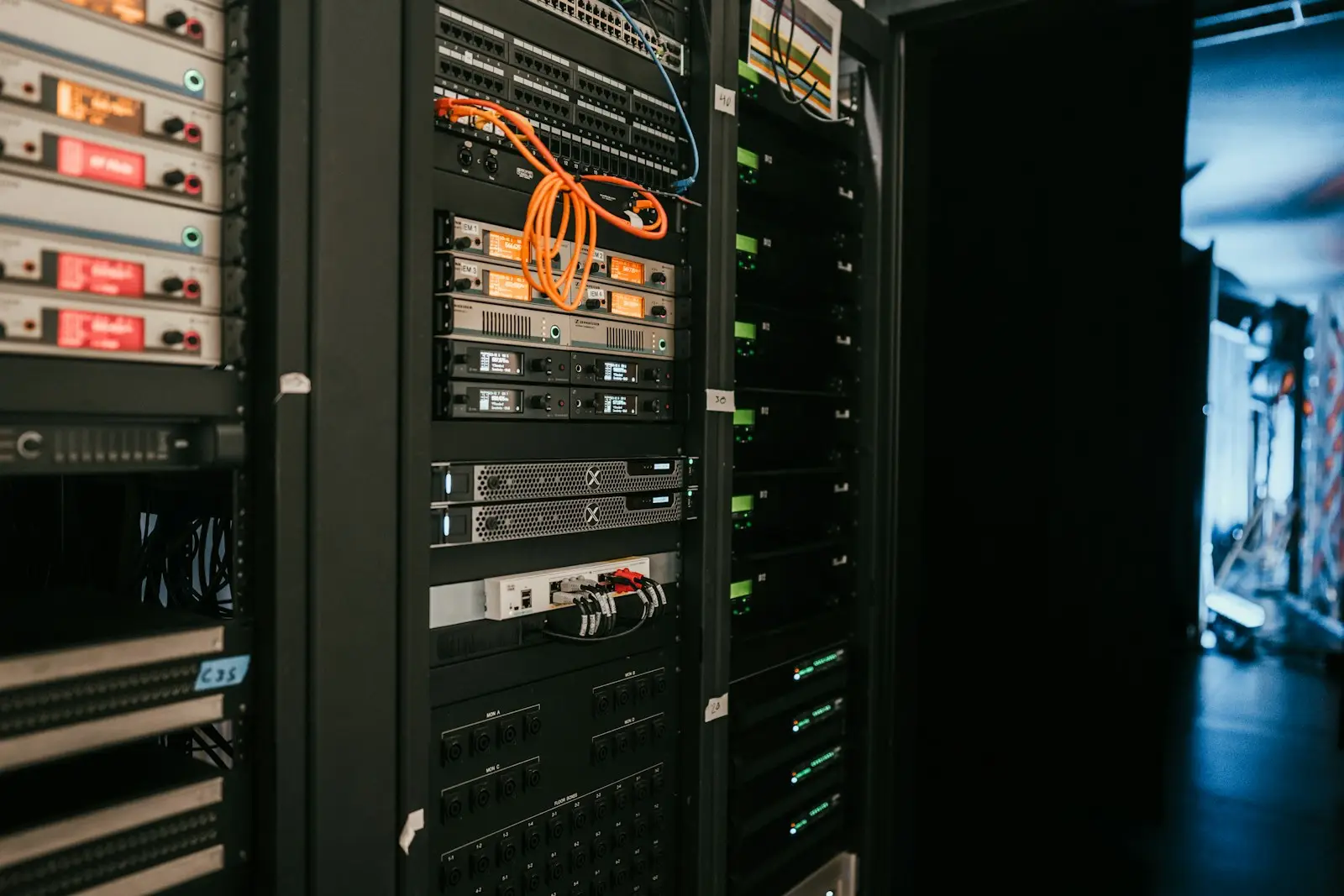 Rows of servers in a data center aisle