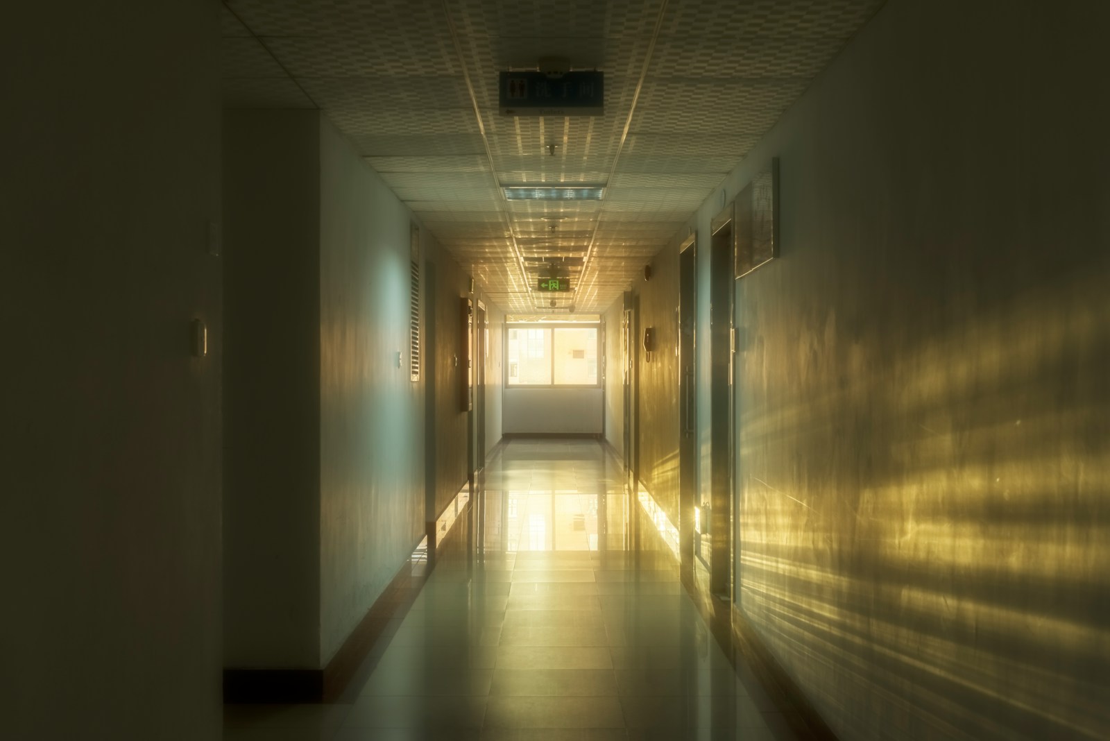 Hospital corridor with wall-mounted service panels