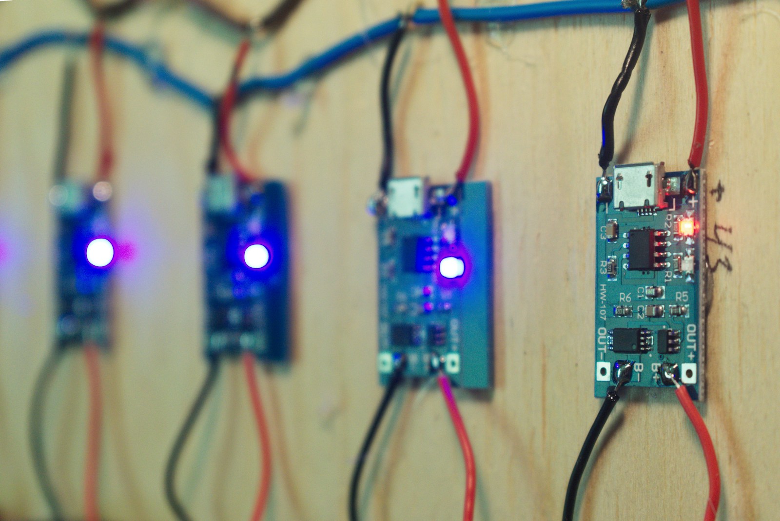 Close view of a populated circuit board on an electronics bench
